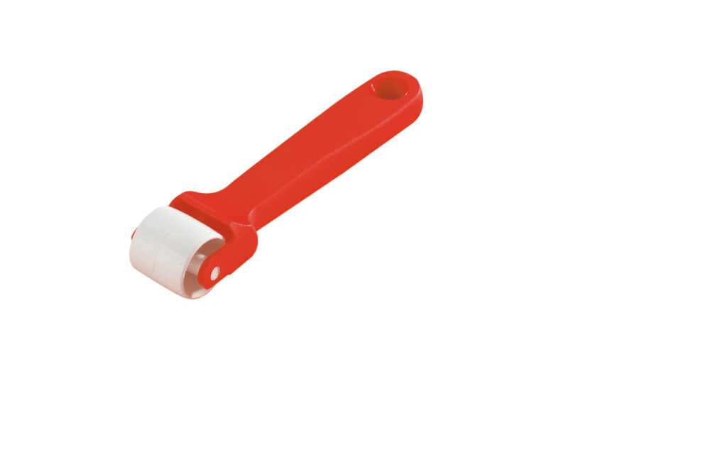 Roulette colleur avec fût en polyamide pour tapissier, garantissant une application uniforme de colle.