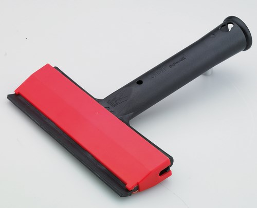 Gratte-carreau manuel avec lame robuste et manche ergonomique pour l'élimination des résidus sur les carreaux.