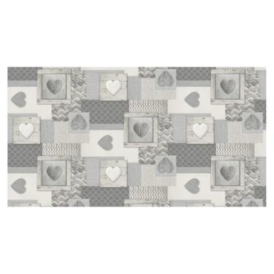Toile cirée au métrage Déco Bisous motif baisers 140 cm x 20 m, imperméable et facile d'entretien.